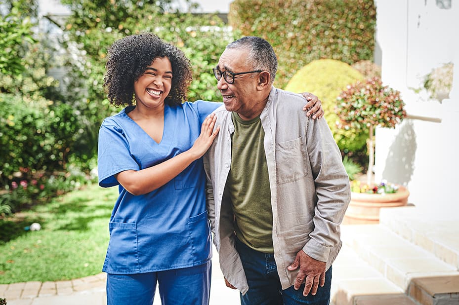 nurse bonding with her senior patient outside